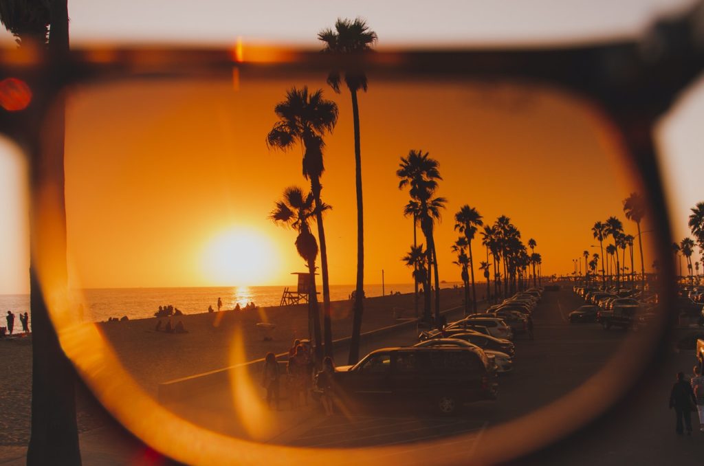 Sunset through sunglasses. Car accident lawyer in Newport Beach.