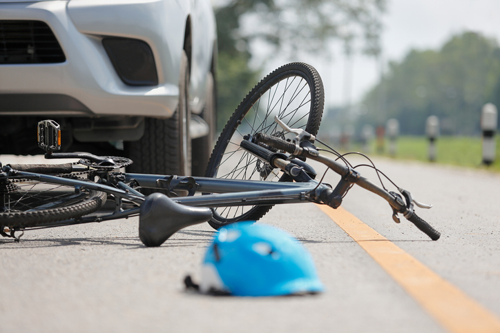 car accident with bicycle lying on the ground