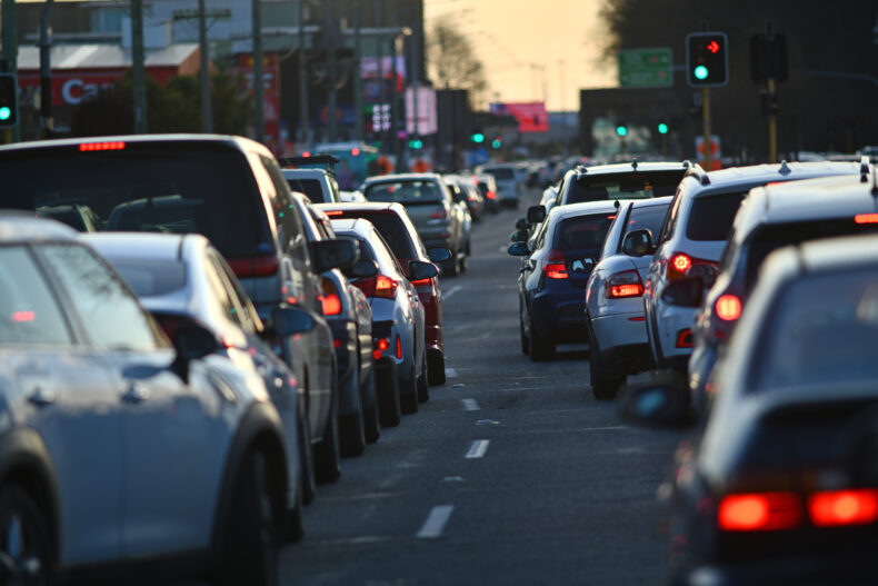 Vehicles line up in peak hour traffic 