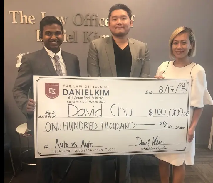 happy-client with a check for $100,000.